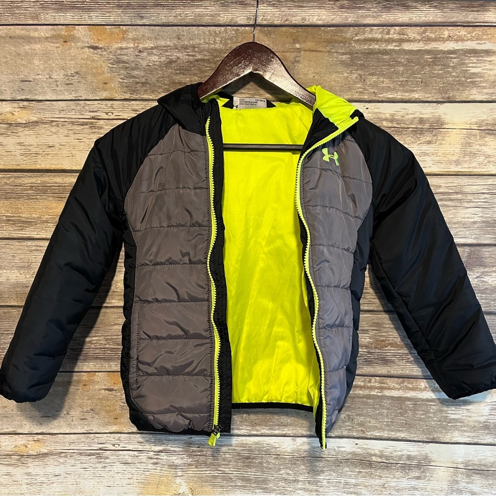 Kids Under Armour puffer jacket with hood.